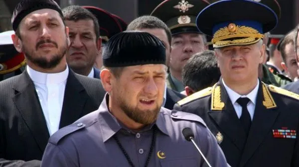 Pakistani military officer speaking at a public event with officials in the background. Channel i News - চ্যানেল আই নিউজ