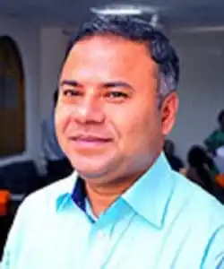বাংলাদেশের একজন নেতা ব্যক্তির ছবি, হাসিমুখে দেখা যাচ্ছে. Channel i News - চ্যানেল আই নিউজ
