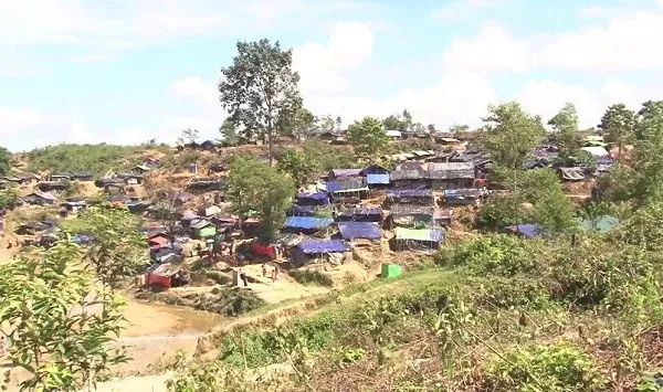 Bangladesh hillside village with makeshift homes and lush greenery. Channel i News - চ্যানেল আই নিউজ
