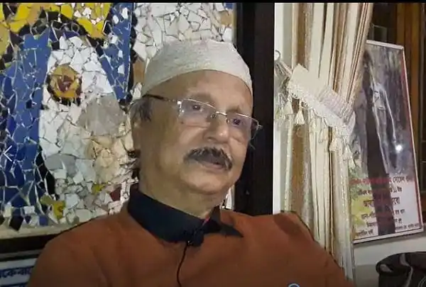 বাংলাদেশের একজন প্রবীণ রাজনীতিবিদ, মাথায় পাগড়ি পরা, চশমা পরিহিত।. Channel i News - চ্যানেল আই নিউজ