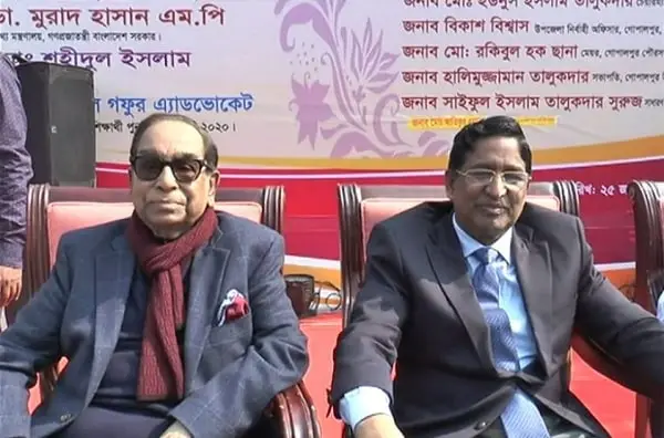 দুই ব্যক্তি বসে আছেন, একটি অনুষ্ঠানে অংশগ্রহণ করছেন. Channel i News - চ্যানেল আই নিউজ