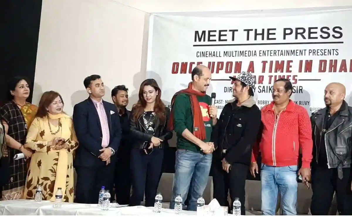 প্রেস কনফারেন্সে অতিথিরা আলোচনা করছেন, পেছনে 'Once Upon a Time in Dhaka' সিনেমার পোস্টার. Channel i News - চ্যানেল আই নিউজ