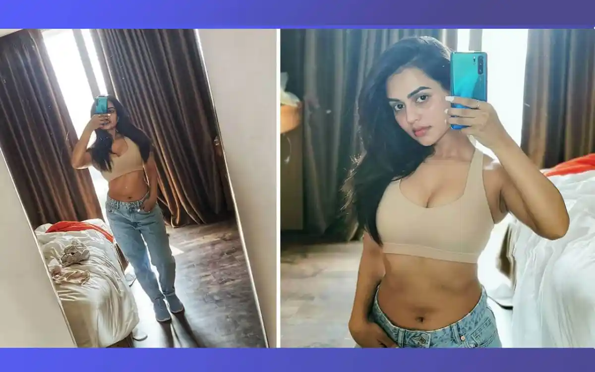 Young woman in beige crop top and jeans taking mirror selfies. Channel i News - চ্যানেল আই নিউজ