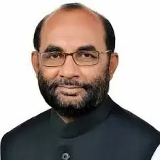 বাংলাদেশের একজন রাজনৈতিক নেতা, পরিপাটি পোষাক ও গোপন চশমা পরা. Channel i News - চ্যানেল আই নিউজ