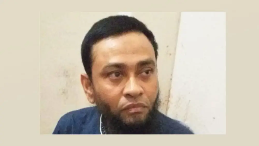 বাংলাদেশের একজন পুরুষ ব্যক্তি, চোখে গভীর ভাবনা, পেছনে সাদা দেয়াল।. Channel i News - চ্যানেল আই নিউজ