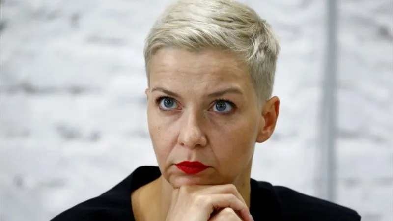 A woman with short blonde hair and red lipstick looks serious. Channel i News - চ্যানেল আই নিউজ