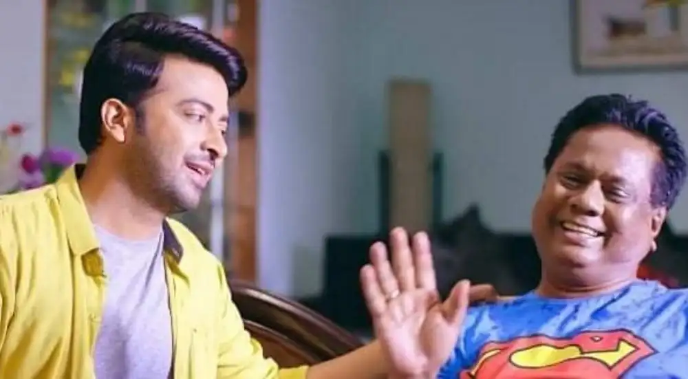 দুই ব্যক্তি হাসিমুখে একে অপরের সাথে কথা বলছে. Channel i News - চ্যানেল আই নিউজ