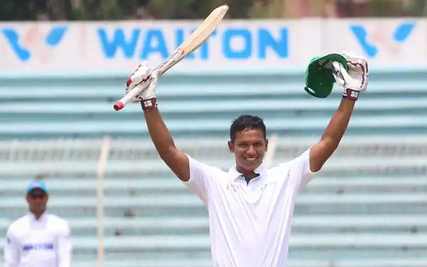 বাংলাদেশ ক্রিকেটার সাইফউদ্দিন ব্যাট হাতে উল্লাসে উদযাপন করছেন. Channel i News - চ্যানেল আই নিউজ