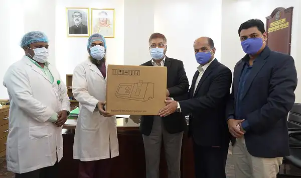 Policemen and medical staff with ventilator box in hospital setting. Channel i News - চ্যানেল আই নিউজ