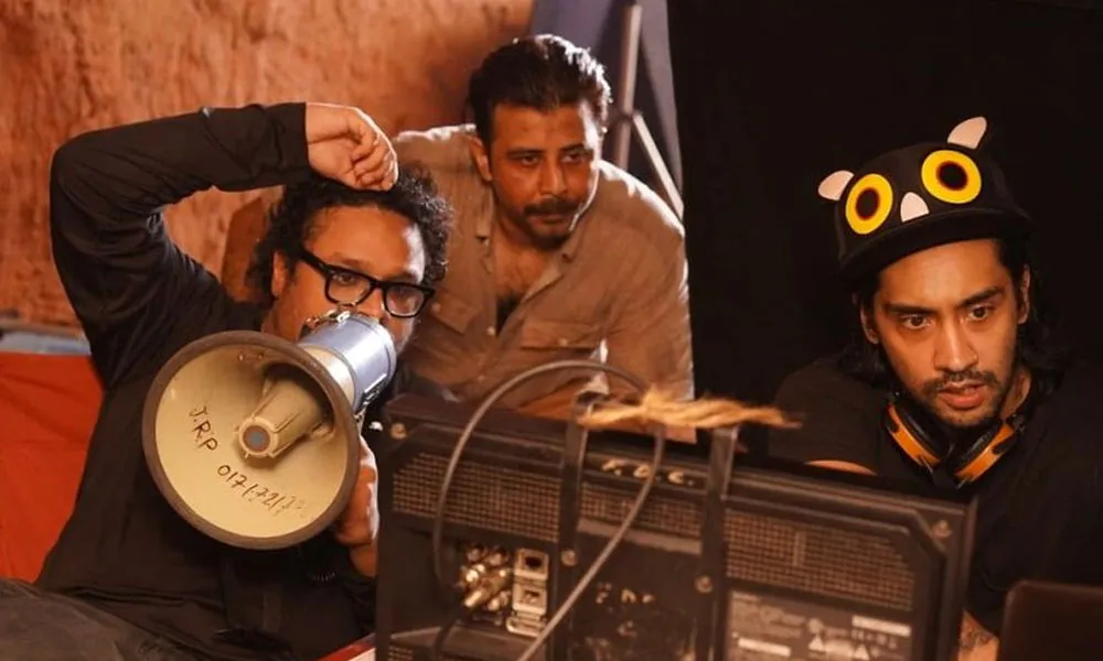 Filmmakers working on a Bengali film set with camera and equipment. Channel i News - চ্যানেল আই নিউজ