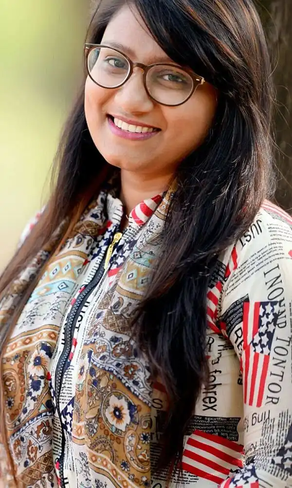 ফেরদৌস ওয়াহিদ হাসিমুখে, কালো শার্ট পরা, চুলে সাদা দাগ. Channel i News - চ্যানেল আই নিউজ