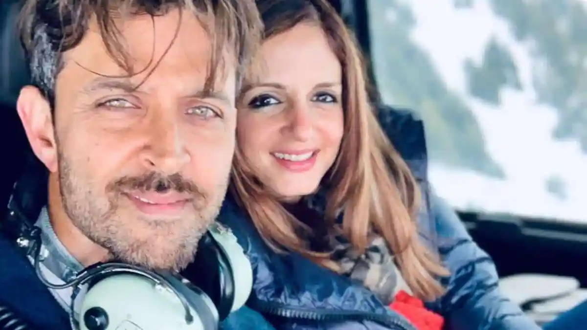 একজন পুরুষ ও একজন নারী গাড়িতে বসে হাসিমুখে ছবি তুলছেন. Channel i News - চ্যানেল আই নিউজ