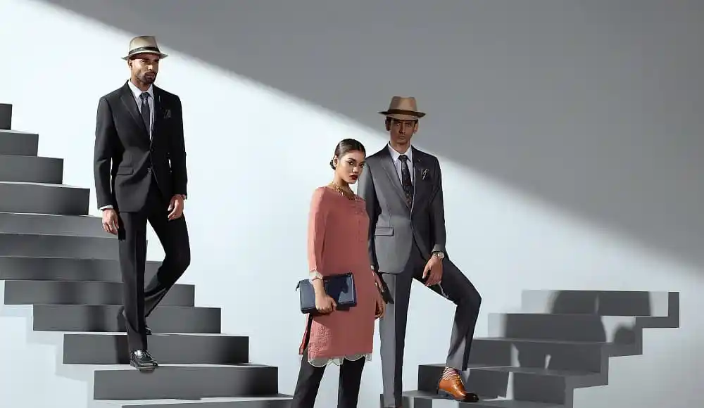 Stylish men and woman in formal wear on modern staircase. Channel i News - চ্যানেল আই নিউজ