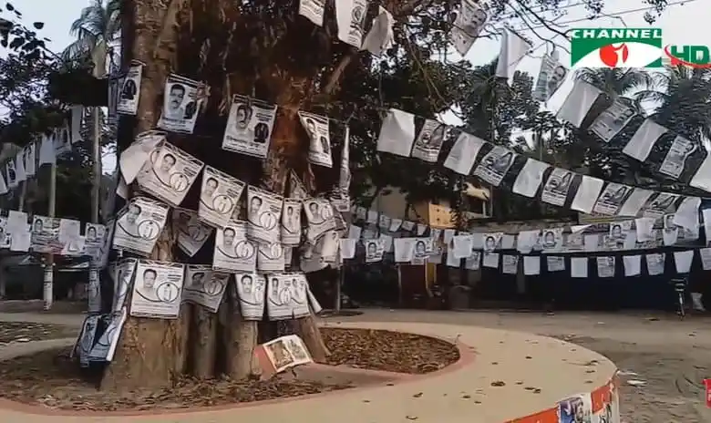নির্বাচনী প্রচারে পোস্টার ও ব্যানার ঝুলছে গাছের সাথে বাঁধা।. Channel i News - চ্যানেল আই নিউজ