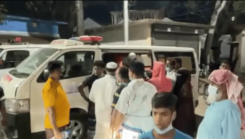 Bangladeshi people gather around an ambulance after an incident. Channel i News - চ্যানেল আই নিউজ