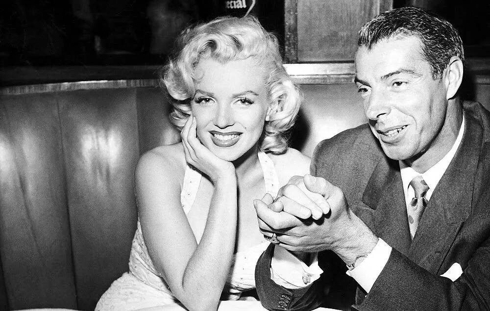 Vintage black and white photo of a smiling woman and man at a social gathering. Channel i News - চ্যানেল আই নিউজ