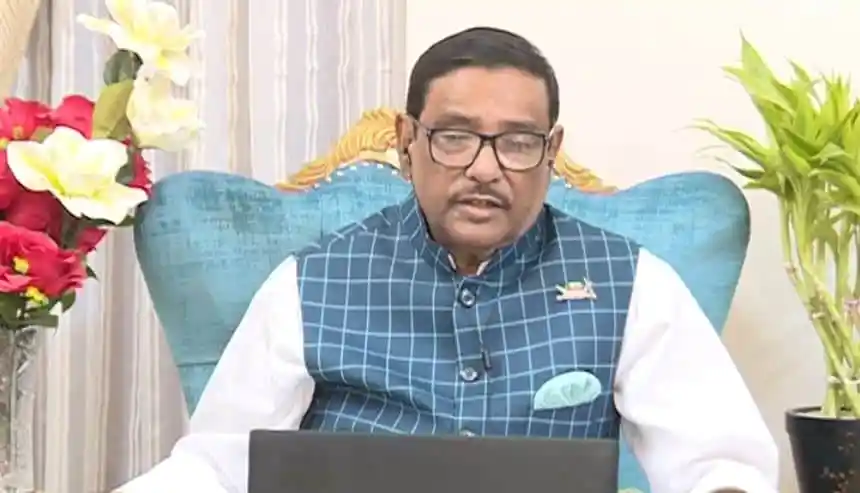 নেতা কাদের সংবাদে বক্তৃতা দিচ্ছেন, পেছনে ফুলের সাজানো ব্যাকড্রপ. Channel i News - চ্যানেল আই নিউজ