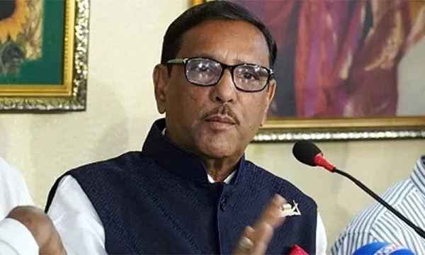 আওয়ামী লীগ নেতা কাদের বক্তৃতা দিচ্ছেন, পেছনে ছবি ও মাইক. Channel i News - চ্যানেল আই নিউজ