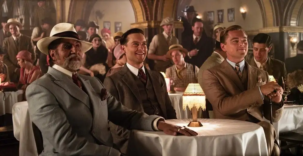 Three men sitting at a table in a vintage-style restaurant or club. Channel i News - চ্যানেল আই নিউজ
