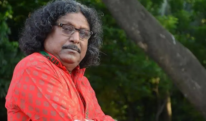 ফকির আলমগীরের ছবি, তিনি গাছে পাশে বসে আছেন. Channel i News - চ্যানেল আই নিউজ