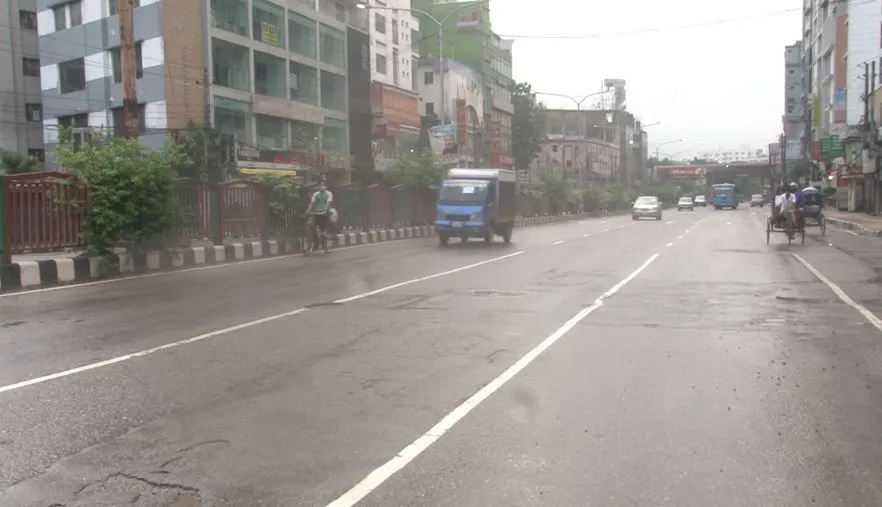 Bangladesh city street with vehicles and buildings on a rainy day. Channel i News - চ্যানেল আই নিউজ