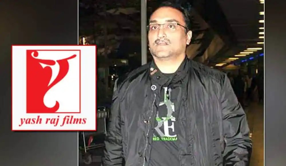 আদিত্যর ছবি, তিনি একটি কালো জ্যাকেট পরেছেন, পেছনে আলো ঝলমলে পরিবেশ. Channel i News - চ্যানেল আই নিউজ