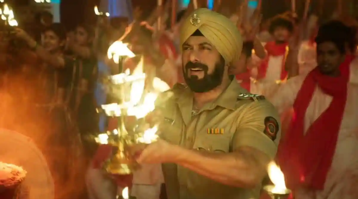 Salman Khan in police uniform performing a ritual with fire during a celebration. Channel i News - চ্যানেল আই নিউজ