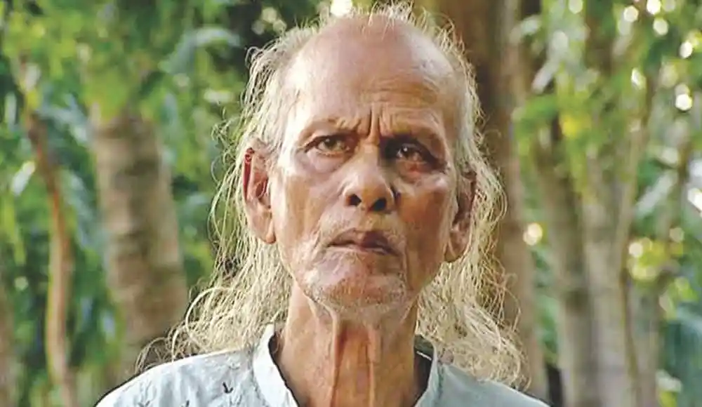 বাউল সম্রাটের স্মৃতি চিহ্নের ছবি, বৃদ্ধ ব্যক্তি বনজঙ্গলে. Channel i News - চ্যানেল আই নিউজ