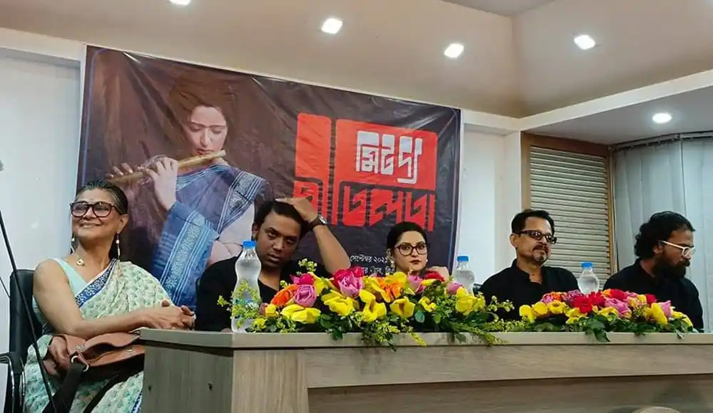 সংবাদ সম্মেলনে উপস্থিত সাংবাদিক ও অতিথিরা বসে আছেন. Channel i News - চ্যানেল আই নিউজ