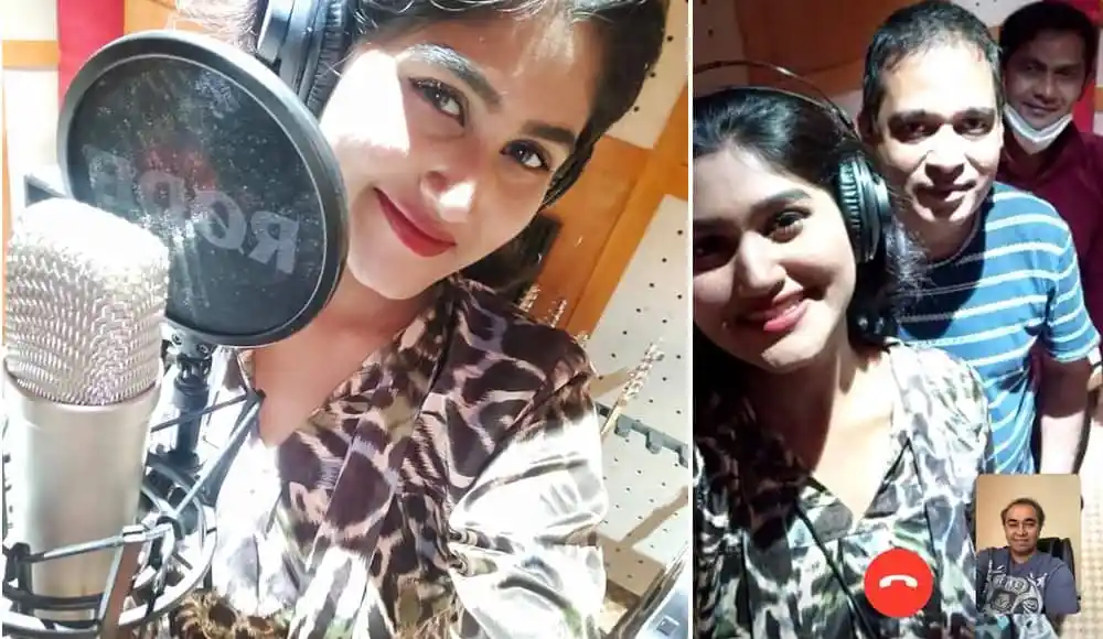 সুমনা স্টুডিওতে গান রেকর্ডিং করছেন, হাসিমুখে ক্যামেরার দিকে তাকিয়ে. Channel i News - চ্যানেল আই নিউজ