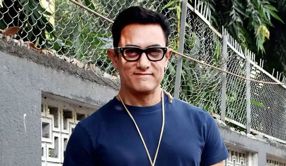 অভিনেতা আমির খান wearing sunglasses and a blue t-shirt. Channel i News - চ্যানেল আই নিউজ