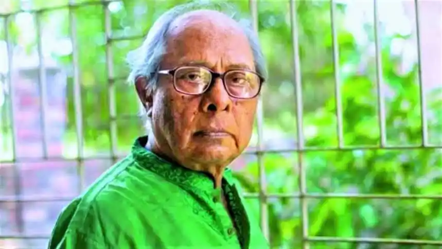 প্রয়াত লেখকের ছবি, গ্রীন শার্ট পরা, গ্লাস পরিহিত, পেছনে সবুজ গাছপালা. Channel i News - চ্যানেল আই নিউজ