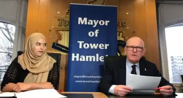 Mayor of Tower Hamlets and a woman at a press conference in London. Channel i News - চ্যানেল আই নিউজ