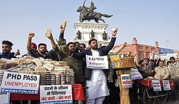 Protesters demonstrate with bread and signs in India, demanding employment. Channel i News - চ্যানেল আই নিউজ
