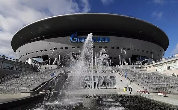 Stadium with water fountain in front, under a blue sky. Channel i News - চ্যানেল আই নিউজ