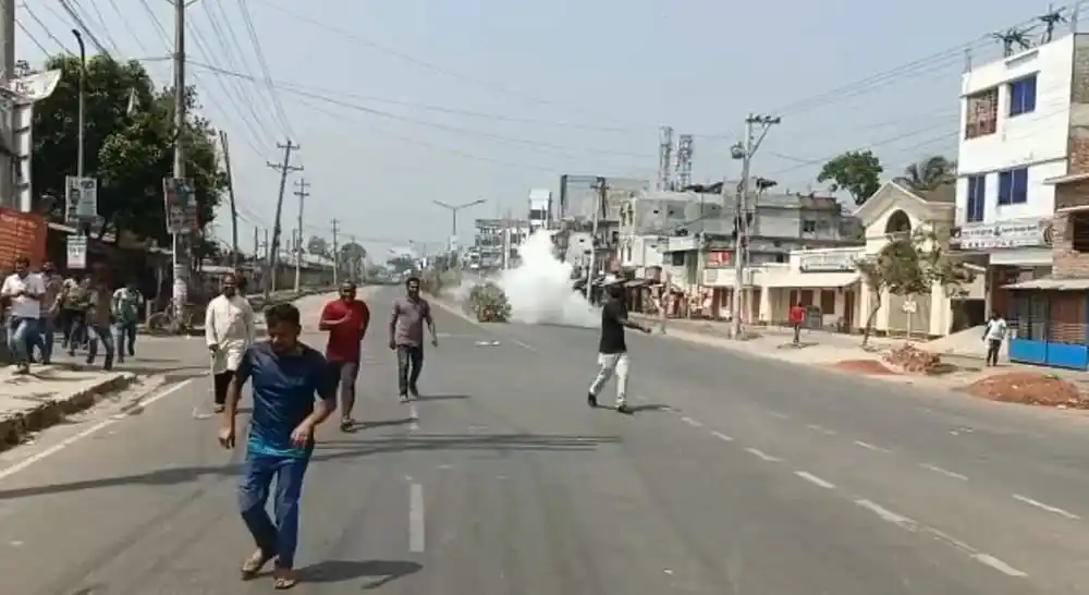 Benapole border area after explosion, smoke rising, people on the street. Channel i News - চ্যানেল আই নিউজ