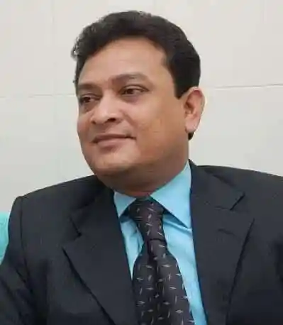 প্রফুল্ল মুখার্জি, একজন পেশাদার ব্যক্তি, সাদা পটভূমিতে।. Channel i News - চ্যানেল আই নিউজ