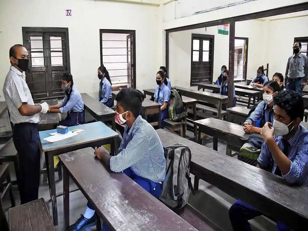 Delhi school students wearing masks attending class amid COVID-19. Channel i News - চ্যানেল আই নিউজ