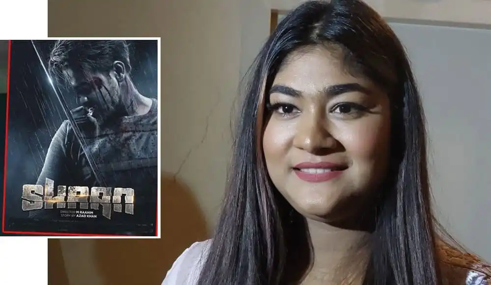 সিয়াম হাসছেন, পাশে শান সিনেমার পোস্টার দেখা যাচ্ছে. Channel i News - চ্যানেল আই নিউজ
