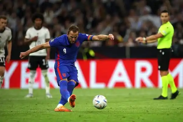 Lionel Messi in action during a football match, kicking the ball on the field. Channel i News - চ্যানেল আই নিউজ