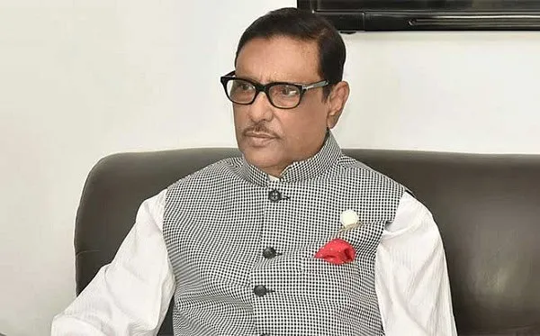 বাংলাদেশের একজন রাজনীতিবিদ বসে আছেন, পরিধান করেছেন চেকered গাউন ও গ্লাস।. Channel i News - চ্যানেল আই নিউজ