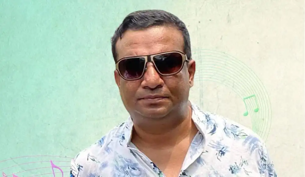 গীতিকার ও পুলিশ কর্মকর্তা লালন, sunglasses পরা, হালকা সবুজ পটভূমিতে. Channel i News - চ্যানেল আই নিউজ