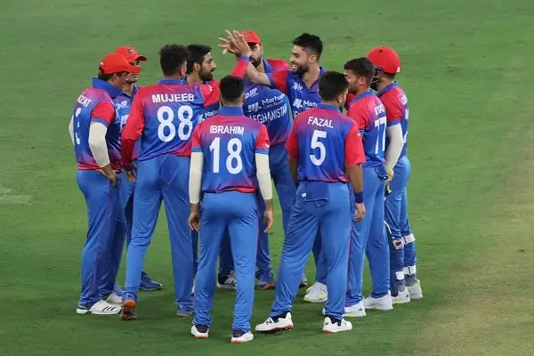 আফগানিস্তান ক্রিকেট দলের খেলোয়াড়রা মাঠে জয়ের উদযাপন করছে।. Channel i News - চ্যানেল আই নিউজ