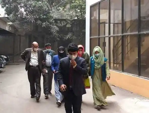 পলাতক পি কে হালদারের দুই সহযোগী গ্রেপ্তার, escorting officers escorting them. Channel i News - চ্যানেল আই নিউজ