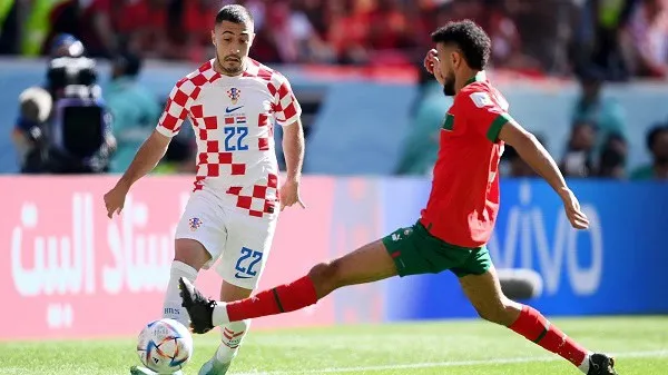 Croatian and Moroccan football players competing during a match. Channel i News - চ্যানেল আই নিউজ