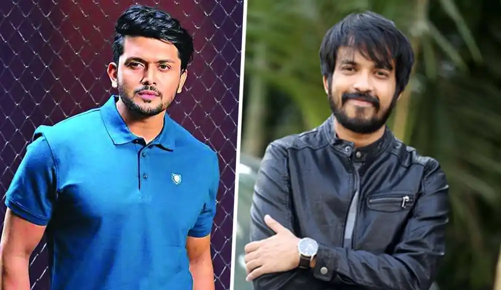 দুই যুবক হাসিমুখে ছবি তুলছেন, একজন ব্লু পোশাক পরেছেন. Channel i News - চ্যানেল আই নিউজ