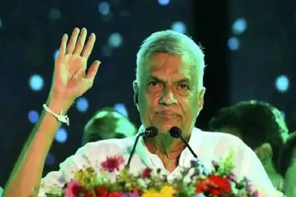 শ্রীলঙ্কার প্রেসিডেন্ট বক্তৃতা দিচ্ছেন, পেছনে আলো ঝলমলে ব্যাকগ্রাউন্ড।. Channel i News - চ্যানেল আই নিউজ
