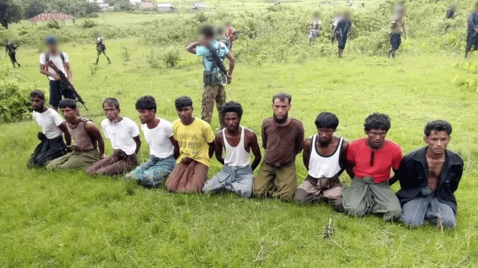 শিশু ও যুবকদের একটি দল মাঠে বসে আছে।. Channel i News - চ্যানেল আই নিউজ