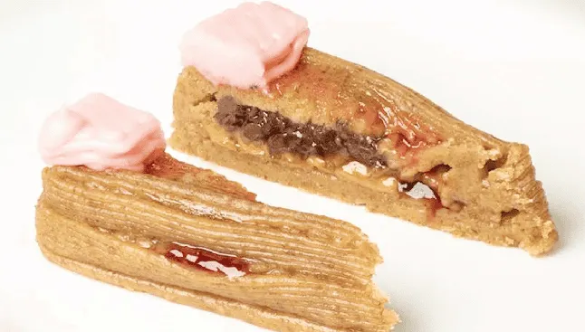 Choux pastry with pink cream and chocolate filling, close-up. Channel i News - চ্যানেল আই নিউজ