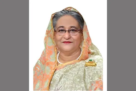 প্রধানমন্ত্রী বাংলাদেশের একজন মহিলা নেতা, পরিপাটি পোশাক পরিহিত।. Channel i News - চ্যানেল আই নিউজ